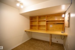 Unfurnished office featuring light carpet and baseboards - 