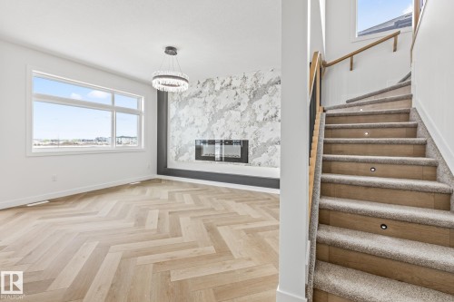 416 Pine Point(E), Leduc, AB - Indoor Photo Showing Other Room With Fireplace