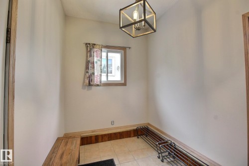 Mud/coats room with tile floor - 4520 20A Avenue, Edmonton, AB - Indoor Photo Showing Other Room
