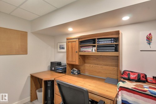 Office area with built in desk and recessed lighting - 4520 20A Avenue, Edmonton, AB - Indoor Photo Showing Office