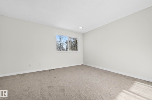 Carpeted empty room with baseboards - 9969 171 Avenue, Edmonton, AB - Indoor Photo Showing Other Room