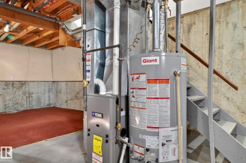 Utilities featuring water heater and heating unit - 9969 171 Avenue, Edmonton, AB - Indoor Photo Showing Basement