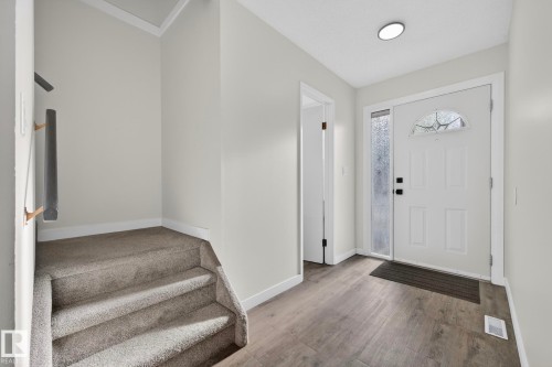 Foyer entrance featuring light wood-type flooring and baseboards - 9969 171 Avenue, Edmonton, AB - Indoor Photo Showing Other Room