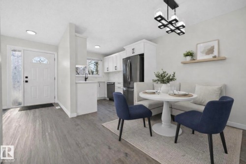 Dining area with baseboards and dark wood-style floors - 9969 171 Avenue, Edmonton, AB - Indoor Photo Showing Dining Room