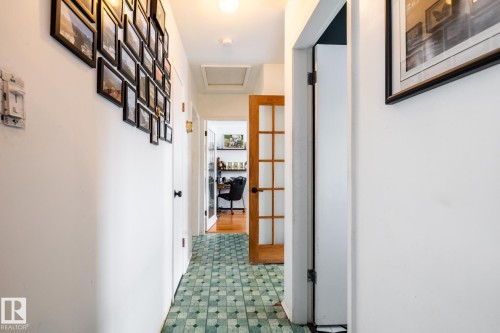 Hallway from the kitchen towards the bathroom and bedrooms - 12231 47 Street, Edmonton, AB - Indoor Photo Showing Other Room