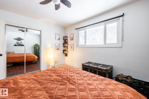 Bedroom with a ceiling fan and a closet - 12231 47 Street, Edmonton, AB - Indoor Photo Showing Bedroom