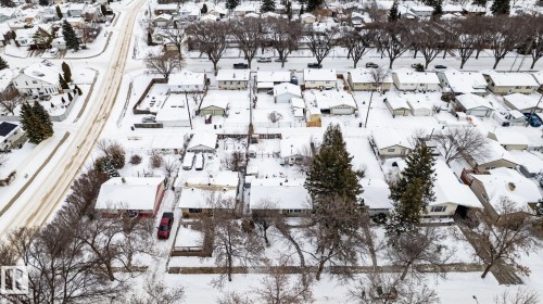 Snowy aerial view featuring the home and surrounding neighbourhood - 12231 47 Street, Edmonton, AB - Outdoor With View