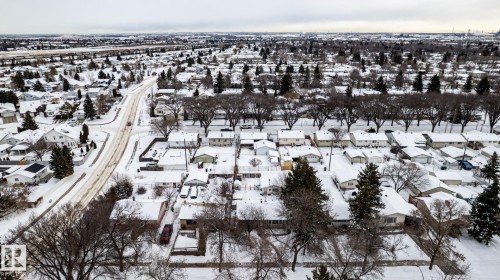 Snowy aerial view featuring the home and surrounding neighbourhood - 12231 47 Street, Edmonton, AB - Outdoor With View
