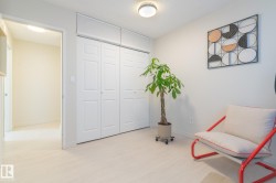 Sitting room with light wood-style flooring and baseboards - 