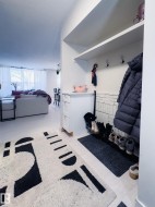 Mudroom featuring a textured ceiling - 