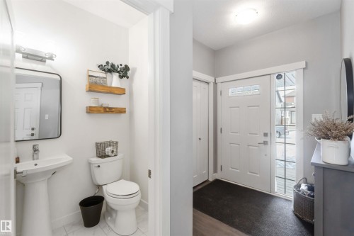 Bathroom featuring toilet and baseboards - 17143 38 Street, Edmonton, AB - Indoor Photo Showing Bathroom