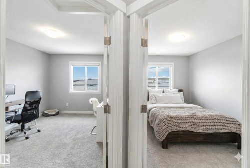Bedroom with light carpet and a desk - 17143 38 Street, Edmonton, AB - Indoor Photo Showing Bedroom