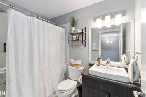 Full bathroom with vanity and curtained shower - 17143 38 Street, Edmonton, AB - Indoor Photo Showing Bathroom