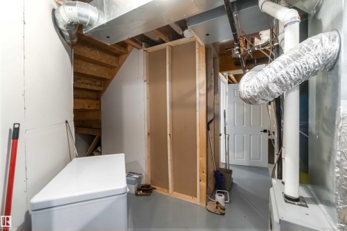 Unfinished basement featuring white fridge - 17143 38 Street, Edmonton, AB - Indoor