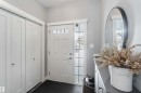 Foyer entrance with dark colored carpet - 17143 38 Street, Edmonton, AB  - Indoor Photo Showing Other Room 
