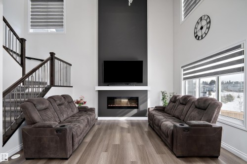 5211 23A Avenue, Edmonton, AB - Indoor Photo Showing Living Room With Fireplace