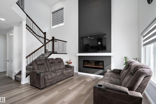 5211 23A Avenue, Edmonton, AB - Indoor Photo Showing Living Room With Fireplace