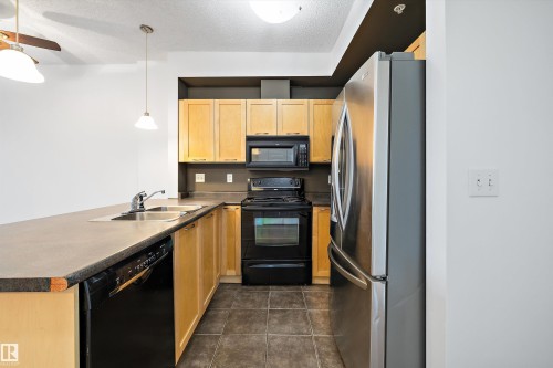1-208 4245 139 Avenue, Edmonton, AB - Indoor Photo Showing Kitchen With Double Sink