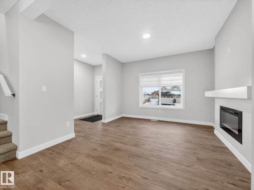301 Brae Way, Leduc, AB - Indoor Photo Showing Living Room With Fireplace