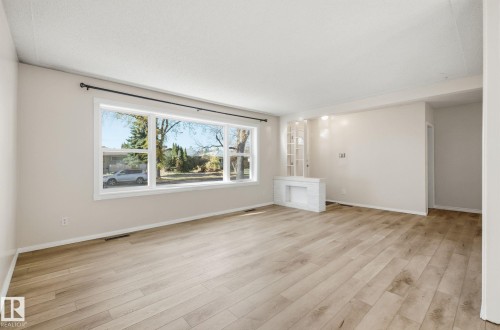 Spare room with light wood finished floors - 12107 53 Street, Edmonton, AB - Indoor Photo Showing Other Room