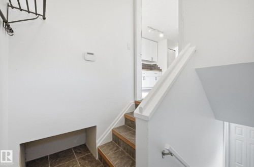 Stairs with track lighting - 12107 53 Street, Edmonton, AB - Indoor Photo Showing Other Room