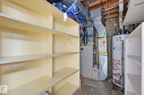 Utilities featuring heating unit and water heater - 12107 53 Street, Edmonton, AB - Indoor Photo Showing Basement