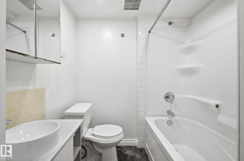 Full bathroom with vanity and washtub / shower combination - 12107 53 Street, Edmonton, AB - Indoor Photo Showing Bathroom