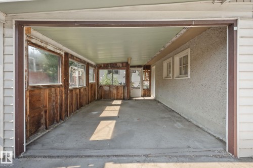 Unfurnished sunroom with a patio area - 12107 53 Street, Edmonton, AB -  With Exterior