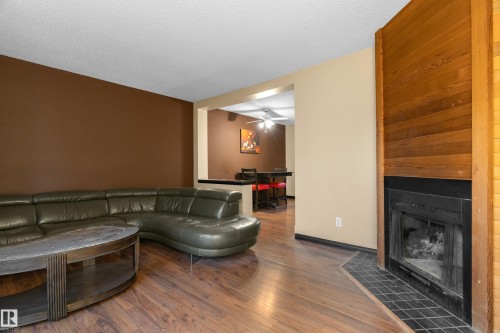 3511 43 Avenue, Edmonton, AB - Indoor Photo Showing Living Room With Fireplace