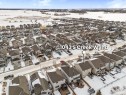 Aerial view of property's location featuring nearby suburban area - 1043 South Creek Wynd, Stony Plain, AB  - Outdoor With View 