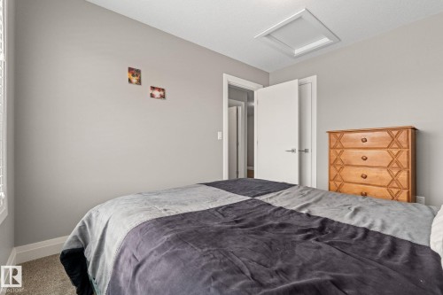 Bedroom with attic access and carpet flooring - 1043 South Creek Wynd, Stony Plain, AB - Indoor Photo Showing Bedroom