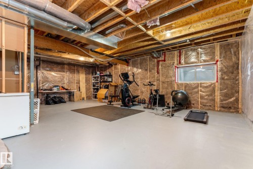 Workout area featuring concrete flooring - 1043 South Creek Wynd, Stony Plain, AB - Indoor Photo Showing Basement