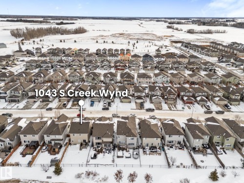 Snowy aerial view featuring a residential view - 1043 South Creek Wynd, Stony Plain, AB - Outdoor With View
