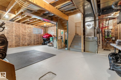 Basement with electric panel and heating unit - 1043 South Creek Wynd, Stony Plain, AB - Indoor Photo Showing Basement