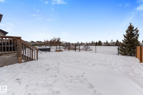 Snowy yard with a wooden deck - 1043 South Creek Wynd, Stony Plain, AB - Outdoor