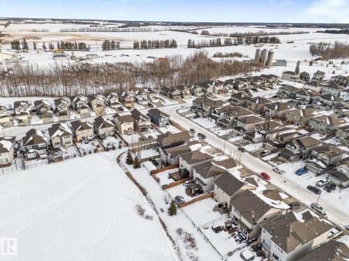 Snowy aerial view with a residential view - 1043 South Creek Wynd, Stony Plain, AB - Outdoor With View