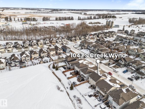 Snowy aerial view with a residential view - 1043 South Creek Wynd, Stony Plain, AB - Outdoor With View