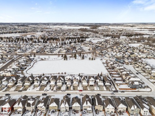 Snowy aerial view with a residential view - 1043 South Creek Wynd, Stony Plain, AB - Outdoor With View