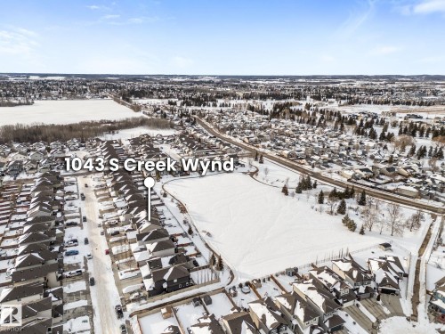 Snowy aerial view featuring a residential view - 1043 South Creek Wynd, Stony Plain, AB - Outdoor With View