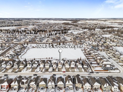 Snowy aerial view with a residential view - 1043 South Creek Wynd, Stony Plain, AB - Outdoor With View
