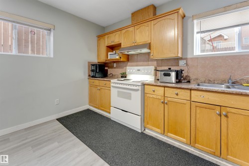 3139 34B Avenue, Edmonton, AB - Indoor Photo Showing Kitchen With Double Sink