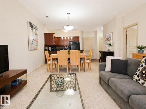 117 160 Magrath Road, Edmonton, AB - Indoor Photo Showing Living Room