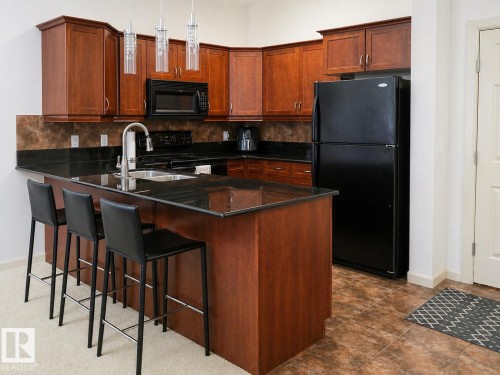 117 160 Magrath Road, Edmonton, AB - Indoor Photo Showing Kitchen With Double Sink