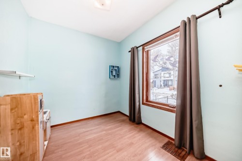 Empty room with light wood finished floors and baseboards - 9823 75 Avenue, Edmonton, AB - Indoor Photo Showing Other Room