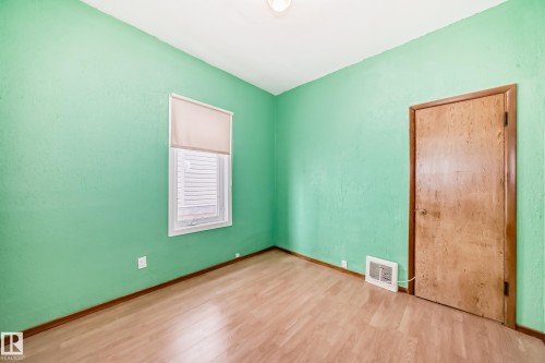 Spare room featuring light wood-style flooring - 9823 75 Avenue, Edmonton, AB - Indoor Photo Showing Other Room