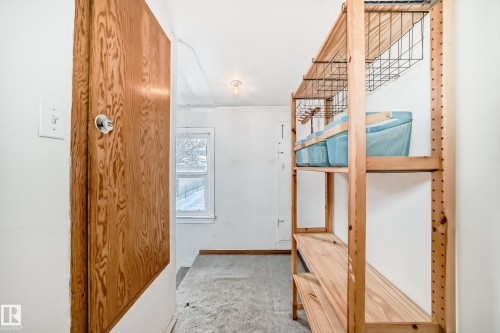 Corridor with carpet flooring and baseboards - 9823 75 Avenue, Edmonton, AB - Indoor Photo Showing Other Room