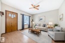 Living room with a ceiling fan and light wood-style flooring - 9823 75 Avenue, Edmonton, AB  - Indoor Photo Showing Living Room 