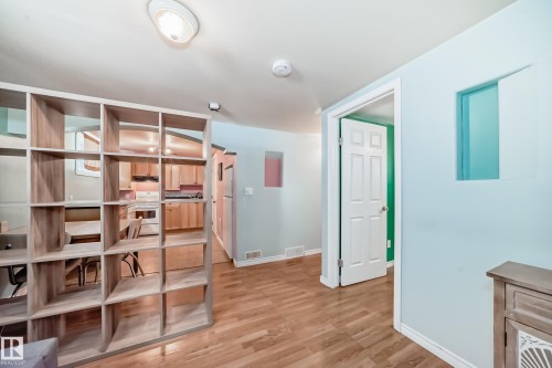 Hall featuring light wood finished floors and baseboards - 9823 75 Avenue, Edmonton, AB - Indoor