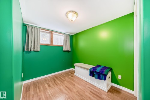 Unfurnished bedroom with baseboards and light wood-style flooring - 9823 75 Avenue, Edmonton, AB - Indoor Photo Showing Other Room