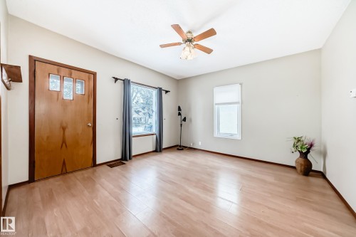 Entrance foyer featuring ceiling fan and light wood-style flooring - 9823 75 Avenue, Edmonton, AB - Indoor Photo Showing Other Room